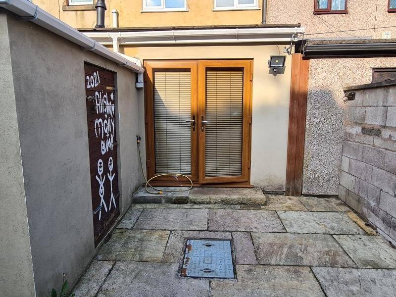 The dated yard required updating to hide the graffiti.