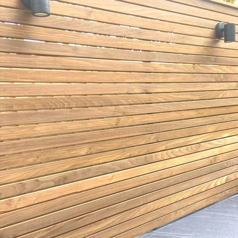 Our slatted Cambia Wood panels are the main focus of this outdoor kitchen project in Manchester. 