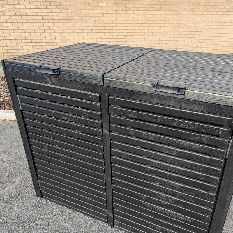 This pressure-treated bin store has been stained black.