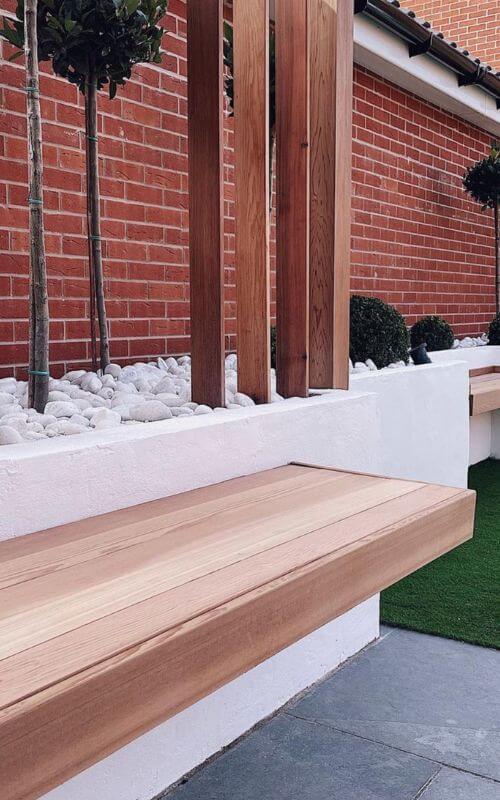 Our Cedar panels, benches, pergola and gate have created a stylish impact on this modern garden renovation.