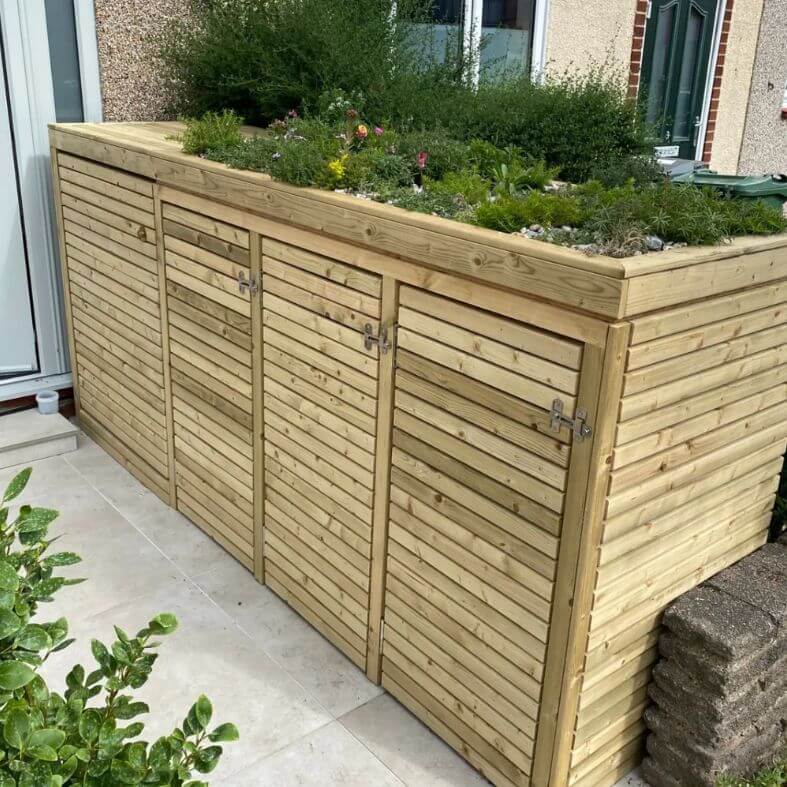 This bin and pram storage feature is made using pressure-treated timbers.