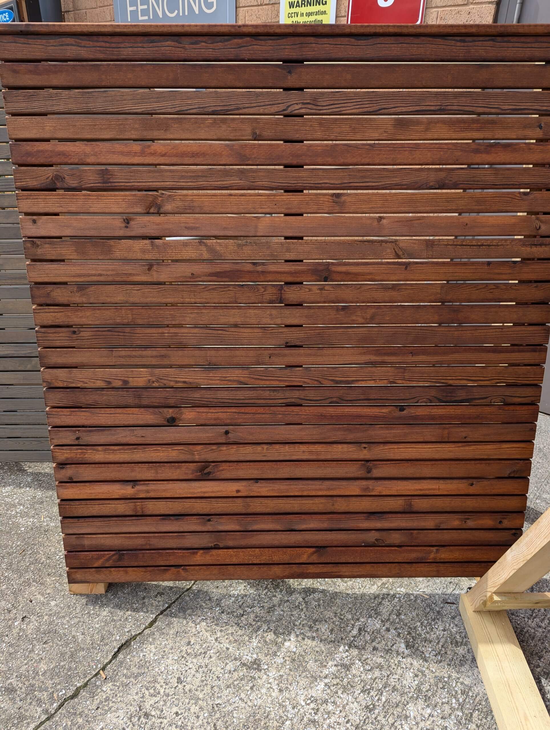 Standing Colour Armour Pro slatted panel shown in Autumn Brown